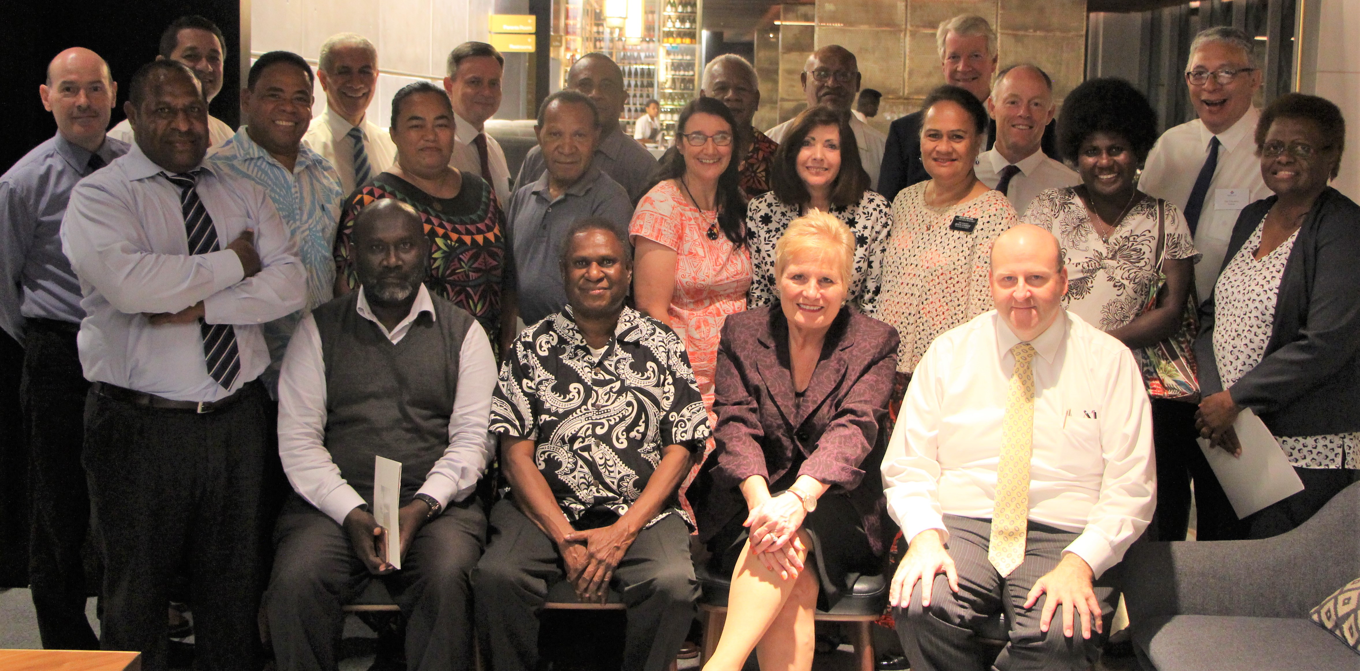 Left to Right - Front Row Seated: Mr. Ray Paul, Chief Commissioner, PNG Customs Services Office; Justice Gibbs Salika, Chief Justice, PNG Supreme Court; Ambassador  Catherine Ebert-Gray, U.S. Ambassador to PNG; Elder Robert Dudfield, LDS Area Seventy overseeing Papua New Guinea. For the full list of those pictured, see below.